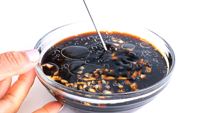 mixing asian sauce in small clear bowl